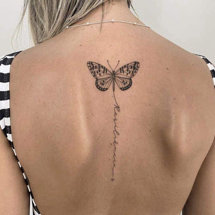 Beautiful and Sexy Tattoos for Women Black butterfly and word Resilience along the spine