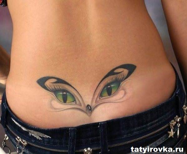 Tatuagens na parte inferior das costas para mulheres com olhos de gato