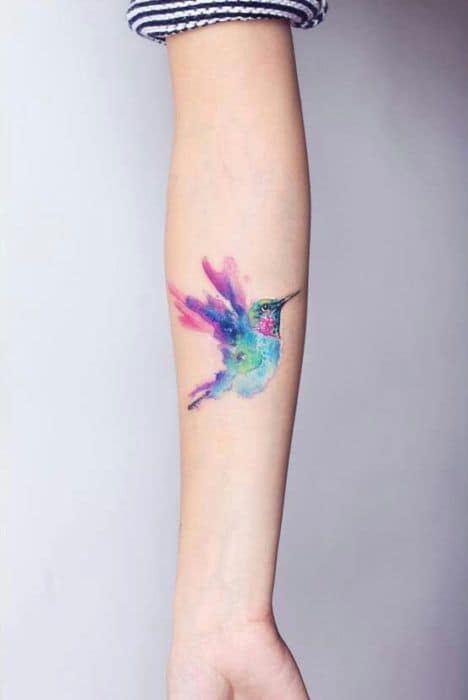 Small Fine Tattoos Hummingbird woman on arm
