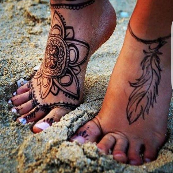 Henna Tattoos Feet and Instep Women feather on one foot lotus flower on the other