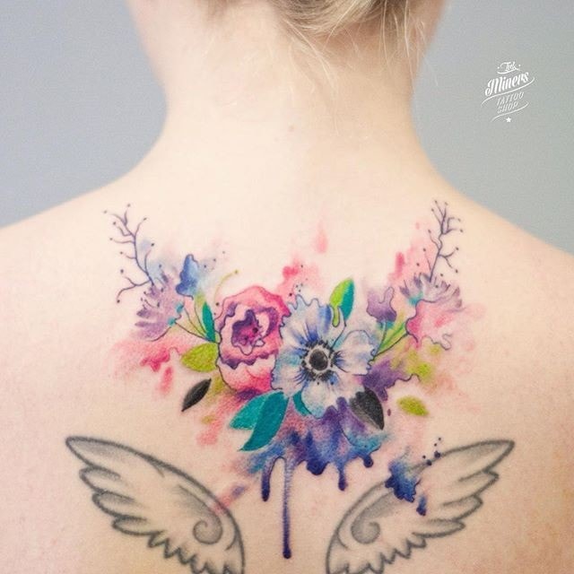 Tattoos Women Back Shoulder blades Flowers of all colors and angel wings 19