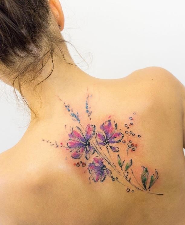 Tattoos Women Back Shoulder blades Flowers bouquet of violet flowers