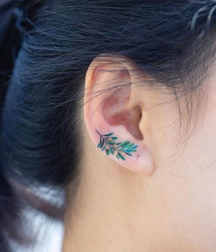 Ears twig tattoos in lobe