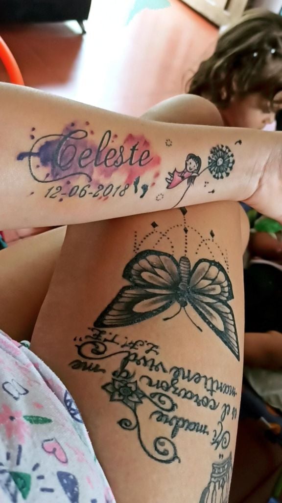 Really Beautiful Tattoos Women on forearm Celestial inscription with date and little feet and girl with dandelion on thigh butterfly and DIVINE inscription