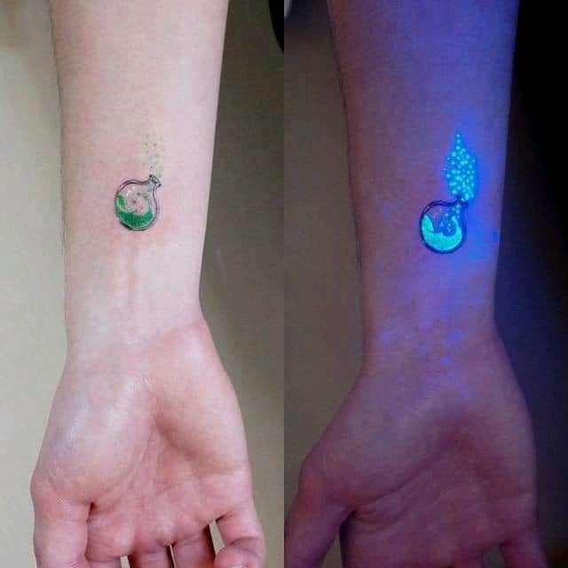 UV potion tattoos on forearm