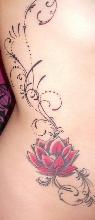 Beautiful tattoos for women of red lotus flower and lattice of branches on the side of the back of a woman's ribs