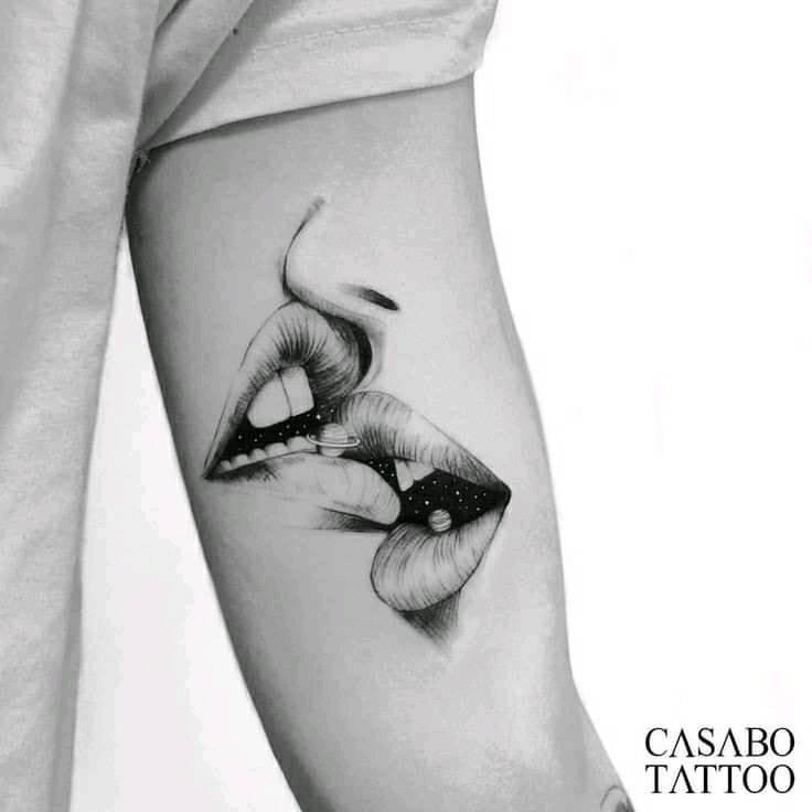 Hugs and Kisses tattoo Two lips kissing on arm