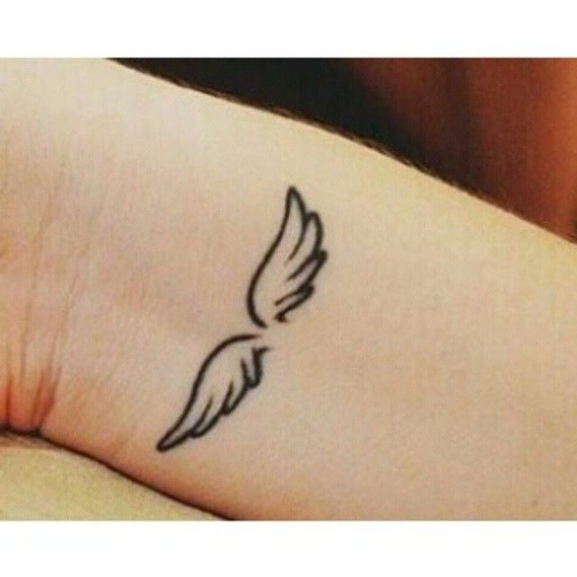 Tattoos of Little Angels Babies Wings on wrist