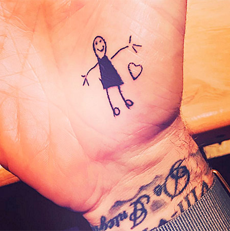 Tattoos of David Beckham in Honor of his Children drawing of Daughter