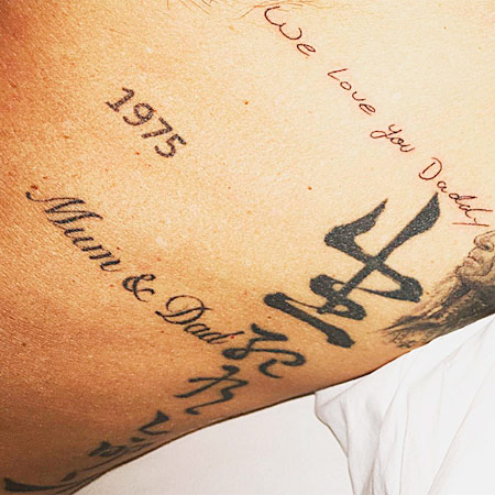 David Beckham tattoos in honor of his children date and names Muni and Dad