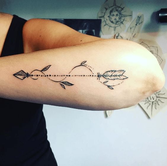 Arrow tattoos with feather and wavy branch 36