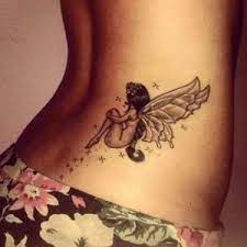 Fairy tattoos on lower back sitting
