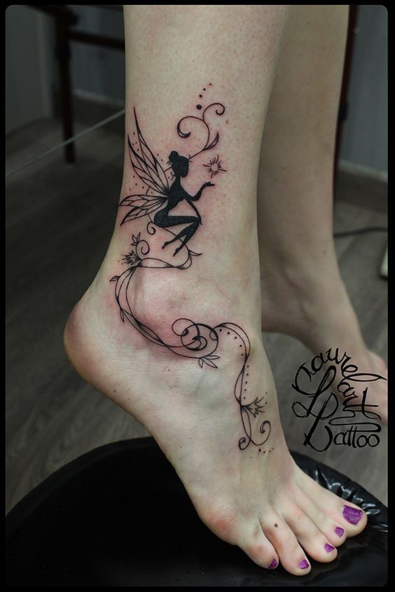Fairy tattoos on the calf with spiral details on the foot