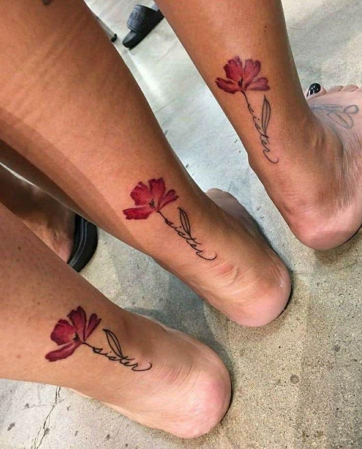 Sisters tattoos Three red flowers on calf