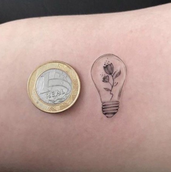 Small focus lamp tattoos like a 1 peso coin