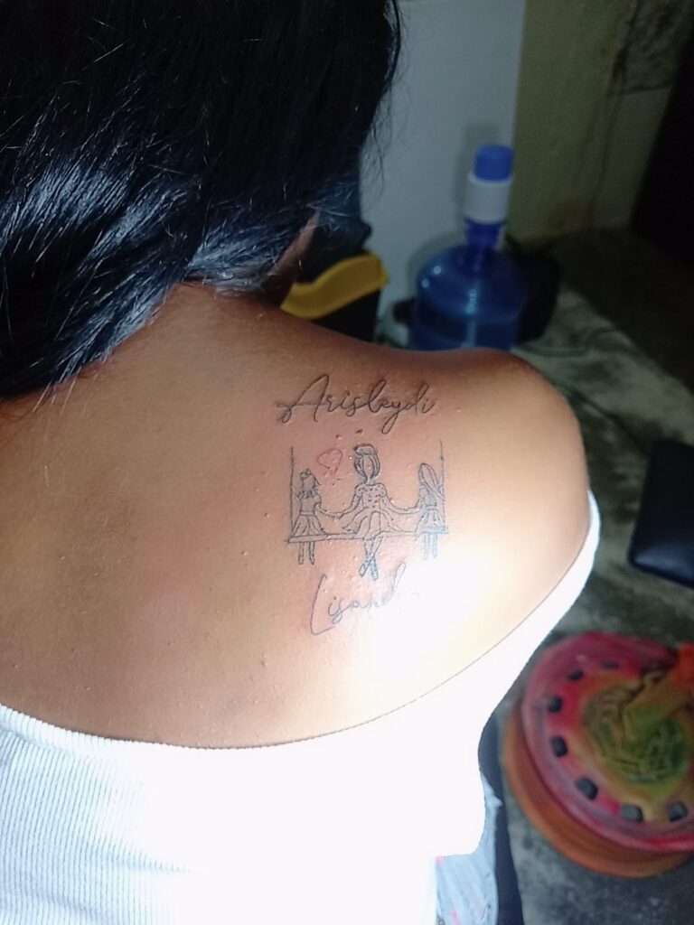 Tattoos from Mothers to Children hammock on shoulder