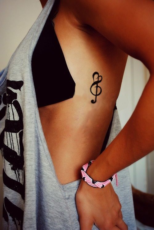 Music tattoos Musical note on the side of the chest woman