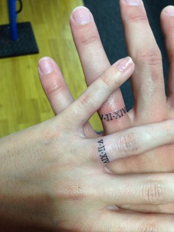 Tattoos of marriage rings or for couples Roman numerals