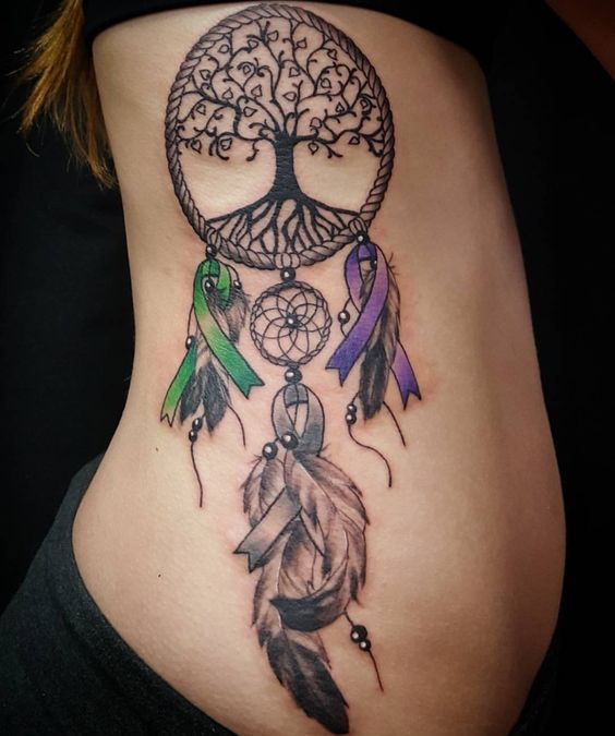 Angel caller dream catcher tattoos with two purple and green crossed ribbons, feathers and tree of life