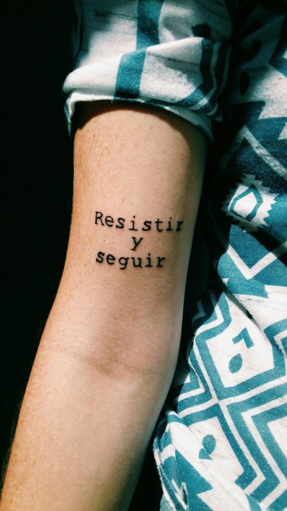 Tattoos of phrases resist and follow