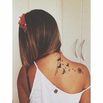 Tattoos on the Neck and Left Shoulder Blade of a dandelion and four flying birds
