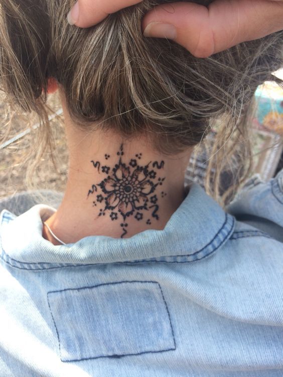 Tattoos on the Nape Neck Black Flower with ornaments