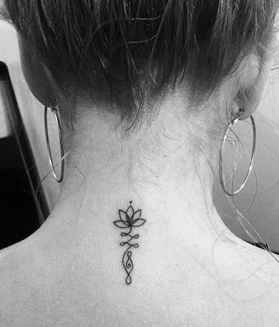 Tattoos on Nape Neck Lotus flower and small dot with ornaments