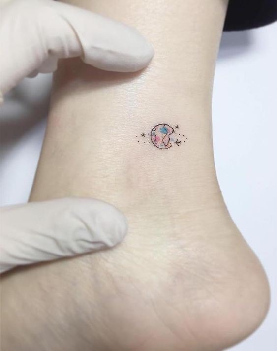 Minimalist super small tattoos the earth and planes