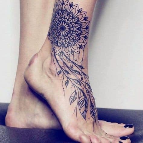 Tatuajes para Mujeres gran flor con ramas en pantorrilla