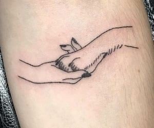 Tatuajes para Perros homenaje a tu mascota pata agarrando mano