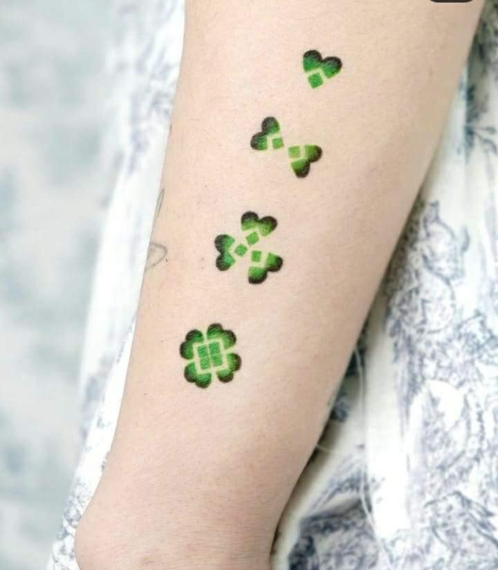 Really beautiful geometric clover tattoos with a progression of four images and one less leaf in each one