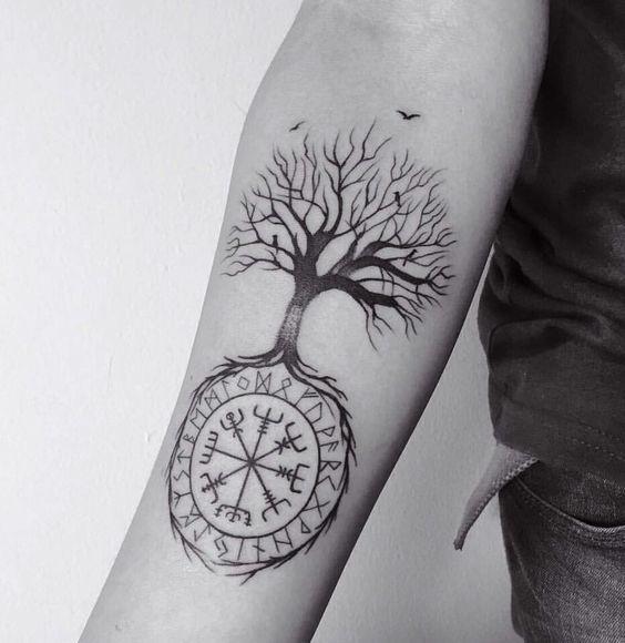 Vegvisir Icelandic runic compass on forearm and tree of life