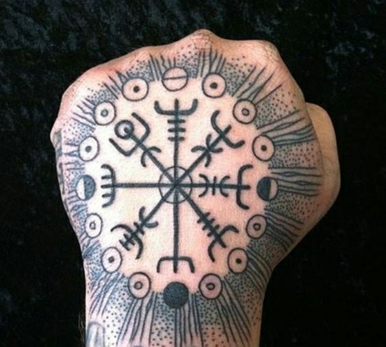 Vegvisir Icelandic runic compass in hand with sunbeams