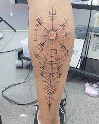 Vegvisir Icelandic runic compass on calf with continuation of lines and arrows