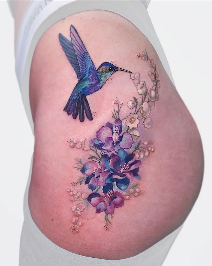 hummingbird tattoo on side of buttock