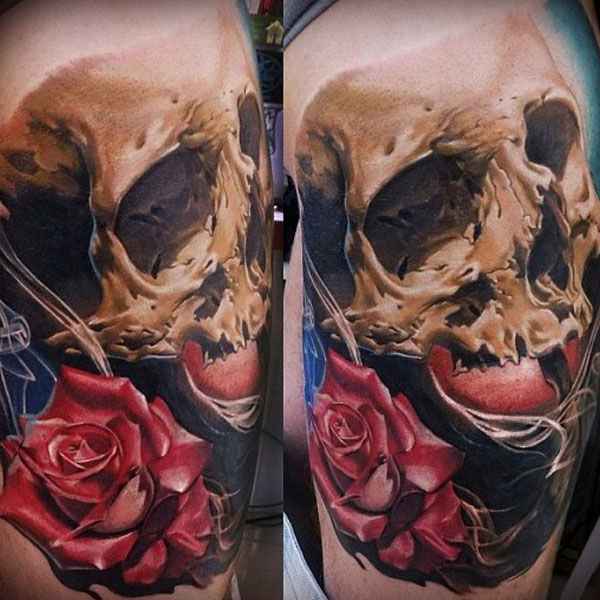 tatuajes y sus significados calavera con rosa en brazo hombre